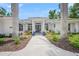 Beautiful shot of the front of this home showing a walkway leading to a front door painted with an eye catching color at 924 Indian Beach Dr, Sarasota, FL 34234