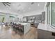 Well-designed kitchen with stainless steel appliances, custom cabinets, and a large central island with seating at 924 Indian Beach Dr, Sarasota, FL 34234