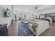Open-concept living area with neutral-toned sofas, large windows, and a partial view of the modern kitchen at 924 Indian Beach Dr, Sarasota, FL 34234