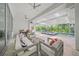 Impressive screened-in pool area with comfortable seating and lush landscaping at 924 Indian Beach Dr, Sarasota, FL 34234