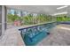 Indoor lap pool area with lush green surroundings at 924 Indian Beach Dr, Sarasota, FL 34234