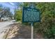 Charming neighborhood street view featuring a historic Indian Beach marker at 924 Indian Beach Dr, Sarasota, FL 34234