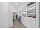Well-organized walk-in closet with custom shelving, hanging racks, and ample storage space at 924 Indian Beach Dr, Sarasota, FL 34234