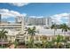 Charming city view featuring palm trees and downtown architecture against a blue sky at 101 S Gulfstream Ave # 6C, Sarasota, FL 34236