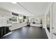 This resident gym has workout mats, free weights, mirrored walls, and multiple windows for natural light at 101 S Gulfstream Ave # 6C, Sarasota, FL 34236