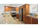 Bright kitchen features granite counters, stainless steel appliances, and wood cabinets at 101 S Gulfstream Ave # 6C, Sarasota, FL 34236