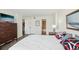A comfortable bedroom featuring ensuite bathroom, dresser and stylish decor at 101 S Gulfstream Ave # 6C, Sarasota, FL 34236