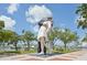 Statue Kiss commemorates the end of World War II, set along the Sarasota Bayfront among boats and tropical foliage at 101 S Gulfstream Ave # 6C, Sarasota, FL 34236