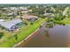 Real estate with a screened pool enclosure overlooks a tranquil pond, combining privacy and scenic views at 104 Hourglass Dr, Venice, FL 34293