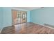 This bedroom has laminate flooring and sliding glass doors at 104 Hourglass Dr, Venice, FL 34293