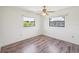 This bedroom has laminate floors and two windows at 104 Hourglass Dr, Venice, FL 34293