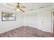 Bright bedroom features hardwood floors, a window and a closet at 104 Hourglass Dr, Venice, FL 34293