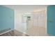 Bright entryway featuring tile floors, fresh blue accent wall, and a view into the spacious living area at 104 Hourglass Dr, Venice, FL 34293