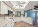 Charming kitchen with white cabinetry, modern appliances, and lots of natural light at 104 Hourglass Dr, Venice, FL 34293
