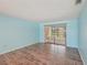 Bright living room with modern design and sliding glass doors to the outside at 104 Hourglass Dr, Venice, FL 34293