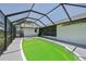 Screened in pool surrounded by concrete deck at 104 Hourglass Dr, Venice, FL 34293