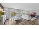 Spacious open-concept living area, with views of the backyard, dining area, and television at 10722 Hidden Banks Gln, Parrish, FL 34219