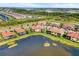 Beautiful aerial perspective of a charming home situated on a waterfront property, surrounded by lush greenery at 10820 Tarflower Dr # 202, Venice, FL 34293