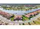 Panoramic aerial view showcasing the community's serene lakes, lush golf course, and elegantly designed homes at 10820 Tarflower Dr # 202, Venice, FL 34293