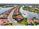 Stunning aerial view of a beautiful home nestled among winding waterways and lush green spaces at 10820 Tarflower Dr # 202, Venice, FL 34293