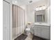 Bright bathroom with a shower-tub combination, a new toilet, and modern vanity at 10820 Tarflower Dr # 202, Venice, FL 34293