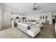 Open-concept living space featuring a modern kitchen, dining area, and comfortable seating at 10820 Tarflower Dr # 202, Venice, FL 34293