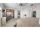 This main bedroom boasts a balcony, ensuite bath, and walk in closet, all awash in natural light at 10820 Tarflower Dr # 202, Venice, FL 34293