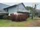 Inviting two-story home featuring a spacious balcony and mature landscaping at 1212 Candlewood Dr, Lakeland, FL 33813