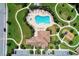 Aerial view of a community clubhouse, playground, and a resort-style pool at 13115 Harriers Pl, Bradenton, FL 34212