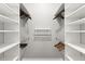 Walk-in closet with custom shelving and rods providing ample storage space and organization at 13115 Harriers Pl, Bradenton, FL 34212