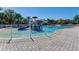 Community pool with zero entry, splash features, waterslides, and a playground at 13115 Harriers Pl, Bradenton, FL 34212