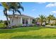 Well-maintained single-Gathering home with lush landscaping, manicured lawn, and beautiful curb appeal at 13115 Harriers Pl, Bradenton, FL 34212