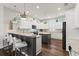 Bright kitchen with granite countertops, stainless appliances, island and breakfast bar seating at 13115 Harriers Pl, Bradenton, FL 34212