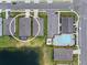 Aerial view highlighting the community layout and proximity to the pool and lake at 13915 Mount Laurel Trl, Bradenton, FL 34211