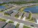 Aerial view of the home in its neighborhood near a lake with fountain and community pool at 13915 Mount Laurel Trl, Bradenton, FL 34211