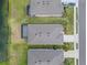 An aerial shot of the roof shows the property line and proximity to the lake at 13915 Mount Laurel Trl, Bradenton, FL 34211