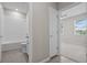 Bright bathroom featuring a tub-shower combo, neutral walls, and modern fixtures for a clean, contemporary feel at 13915 Mount Laurel Trl, Bradenton, FL 34211