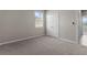 Clean bedroom with neutral carpeting, double door closet, and window, suitable for many styles of decor at 13915 Mount Laurel Trl, Bradenton, FL 34211