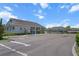 Well-kept community entrance with ample parking and lush landscaping at 13915 Mount Laurel Trl, Bradenton, FL 34211