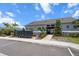 Well-maintained community mailboxes and entrance gate under a bright sky at 13915 Mount Laurel Trl, Bradenton, FL 34211