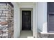Close up of the front door with sidelight window at 13915 Mount Laurel Trl, Bradenton, FL 34211
