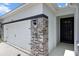 Close up of the front door and a two car garage at 13915 Mount Laurel Trl, Bradenton, FL 34211