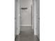 Hallway view showing doors, shelving and tile flooring at 13915 Mount Laurel Trl, Bradenton, FL 34211