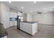 Kitchen featuring an island, and a tiled backsplash at 13915 Mount Laurel Trl, Bradenton, FL 34211