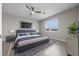 Well-furnished main bedroom featuring a king bed, stylish decor, and natural light at 13915 Mount Laurel Trl, Bradenton, FL 34211