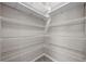 Walk-in pantry with multiple levels of wire shelving at 13915 Mount Laurel Trl, Bradenton, FL 34211