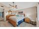 Comfortable bedroom with a ceiling fan, nautical decor, and soft natural light from the window at 1612 Shady Leaf Dr, Valrico, FL 33596