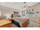 Comfortable bedroom with a ceiling fan, nautical decor, and soft natural light from the window at 1612 Shady Leaf Dr, Valrico, FL 33596