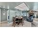 Dining room with a view into the living room and stone fireplace at 1612 Shady Leaf Dr, Valrico, FL 33596