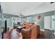 Spacious living room with wood floors, neutral walls, and access to the pool area at 1612 Shady Leaf Dr, Valrico, FL 33596